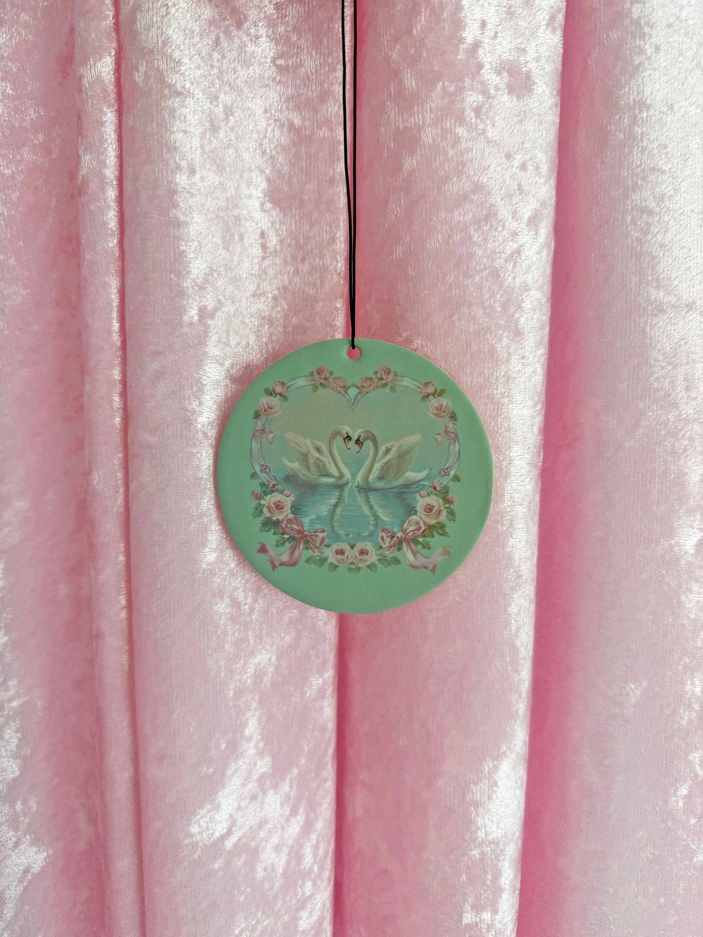 Sage green swan-themed car freshener, vanilla scented