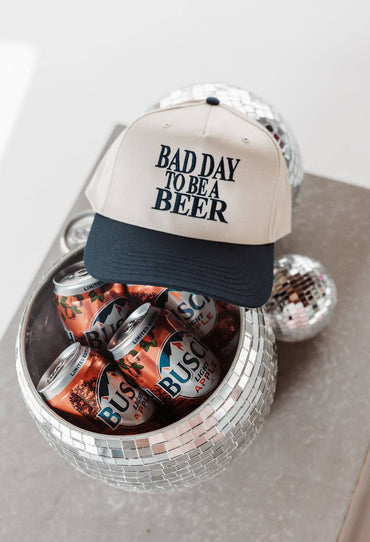 Adjustable dad hat with “Bad Day to Be a Beer” stitching gift store