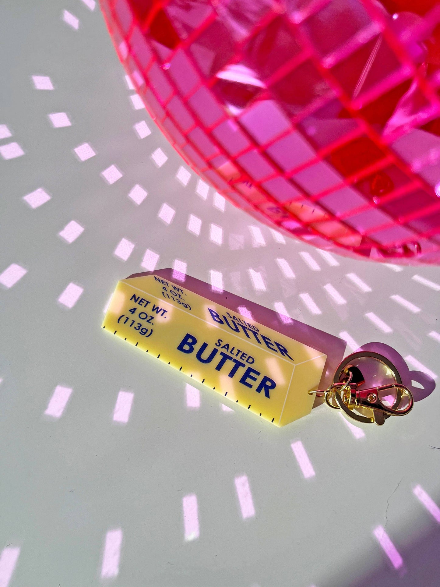 Acrylic keychain shaped like a stick of butter – unique foodie accessory and foodie gift