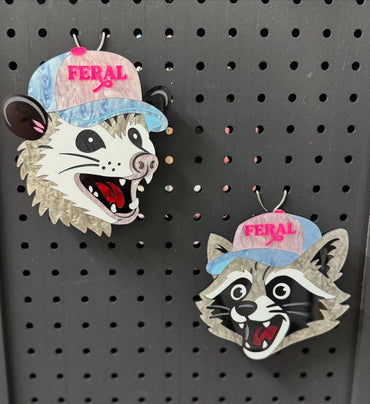 Cute raccoon and possum in pastel hats wall art