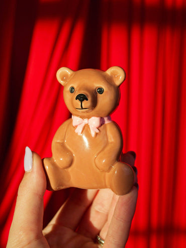 Small bear-shaped match holder with strike base and matches inside