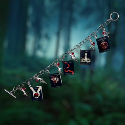 Handmade Twilight bracelet featuring Twilight, New Moon, Eclipse, Breaking Dawn, and Midnight Sun charms. gift store