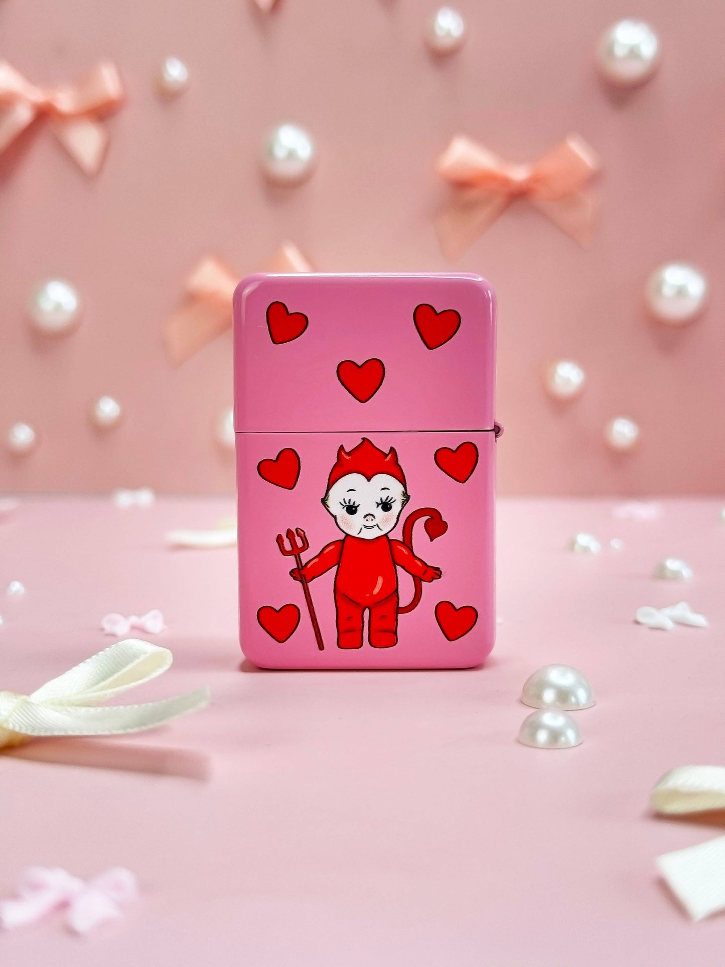 Pink Kewpie lighter with angel and devil sides