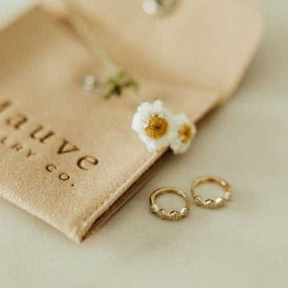 Hypoallergenic gold huggie hoops with diamond accent