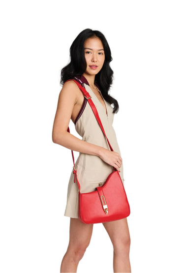 Chic everyday crossbody with unique silhouette and secure closure