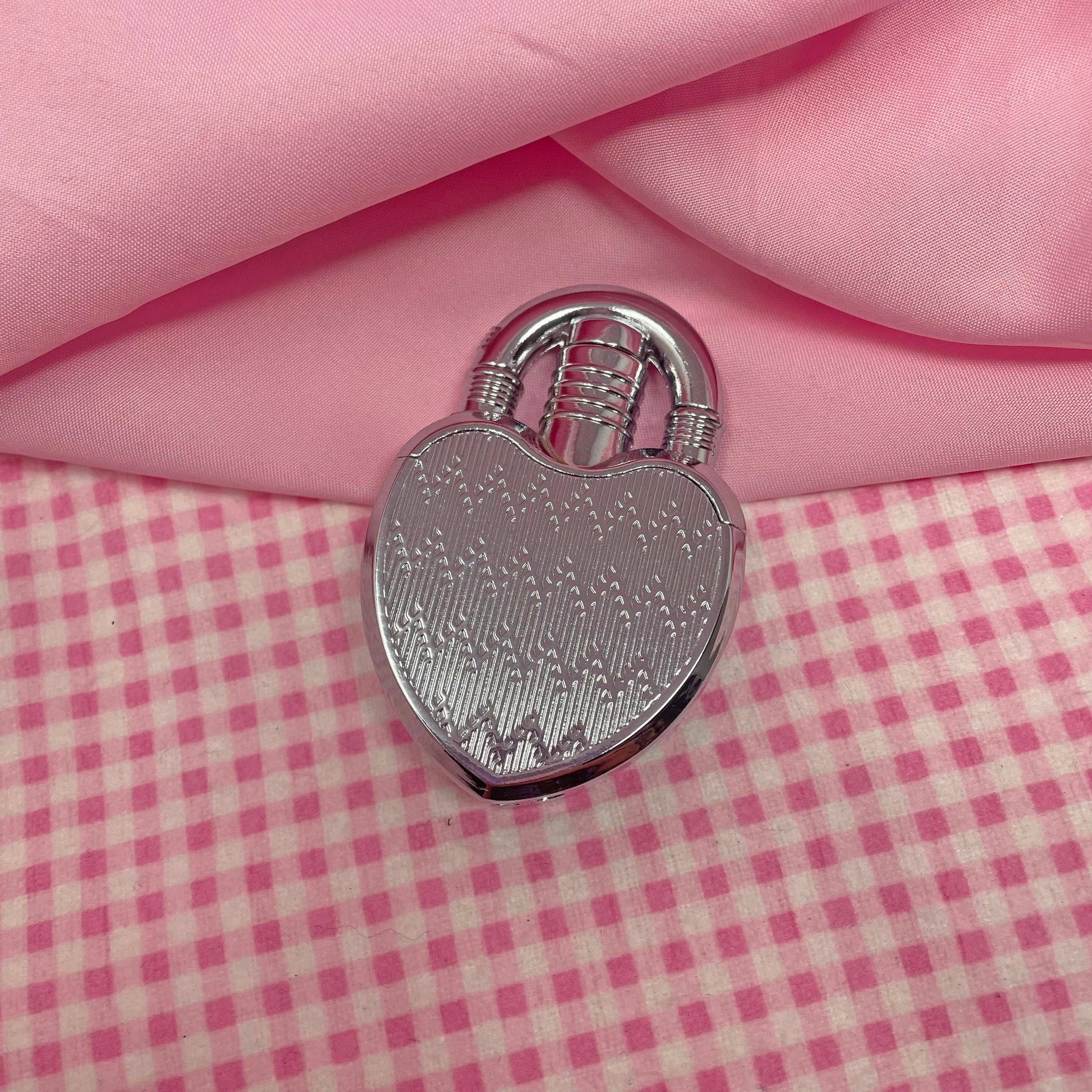 Silver heart-shaped lock lighter with flip top