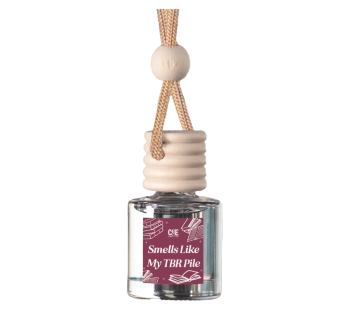 Book inspired car air freshener with parchment and ink scent
