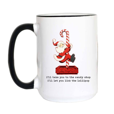 White mug with black handle featuring a Christmas design of Santa Claus and candy cane, text on a white background gift store knoxville