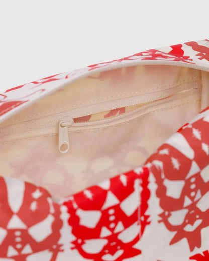 Baggu Dopp kit in Cowgirl print styled with toiletries, a playful and practical gift store favorite