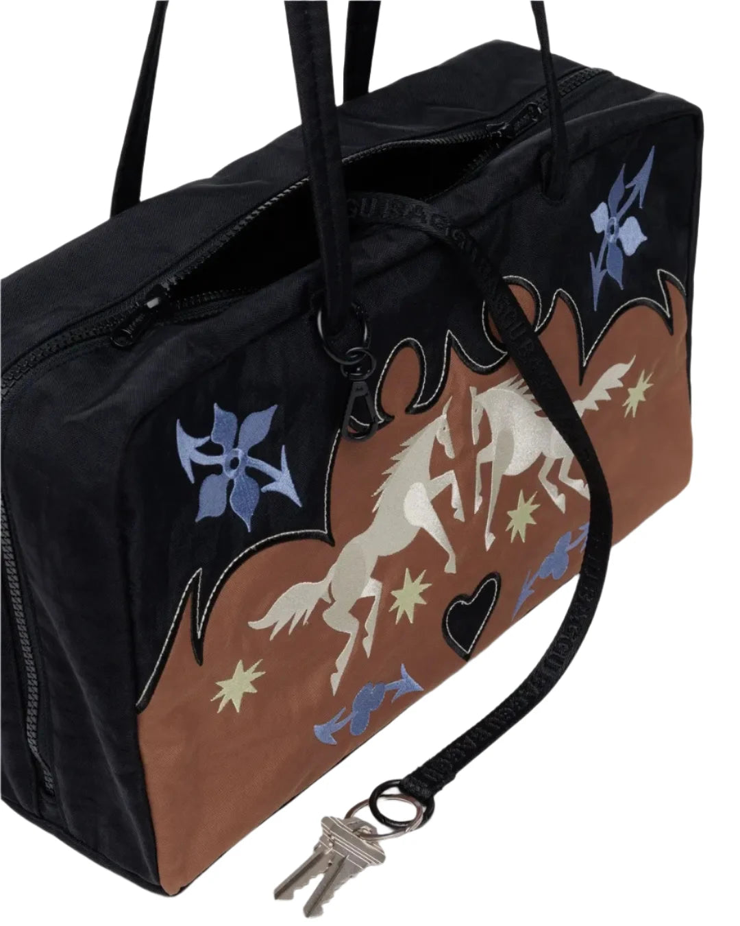 Spacious interior of Baggu bowler bag with zip pocket and key leash, great gift shop item