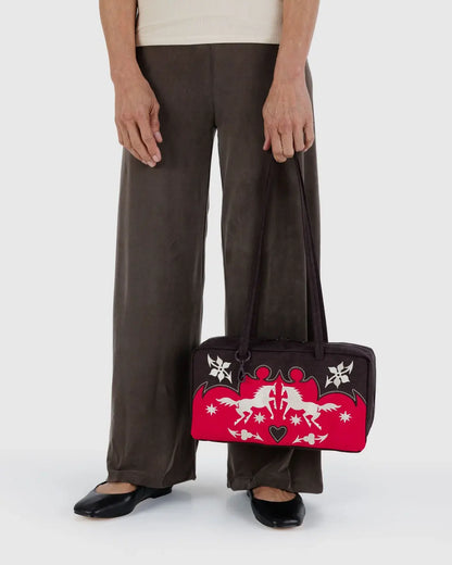 Baggu bowler bag customized with accessories on charm loops and clip ring, ideal gift shop bag