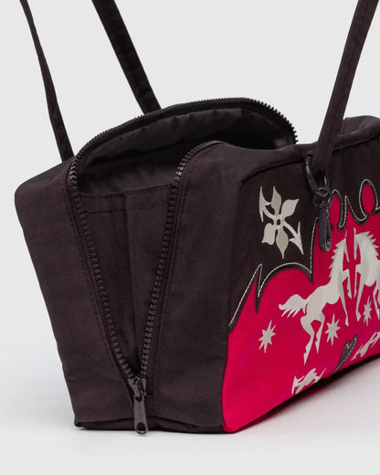 Model carrying small Baggu bowler bag with shoulder straps, great eco-friendly gift option